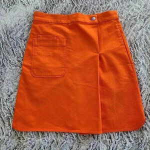 COS orange mini skirt with pockets